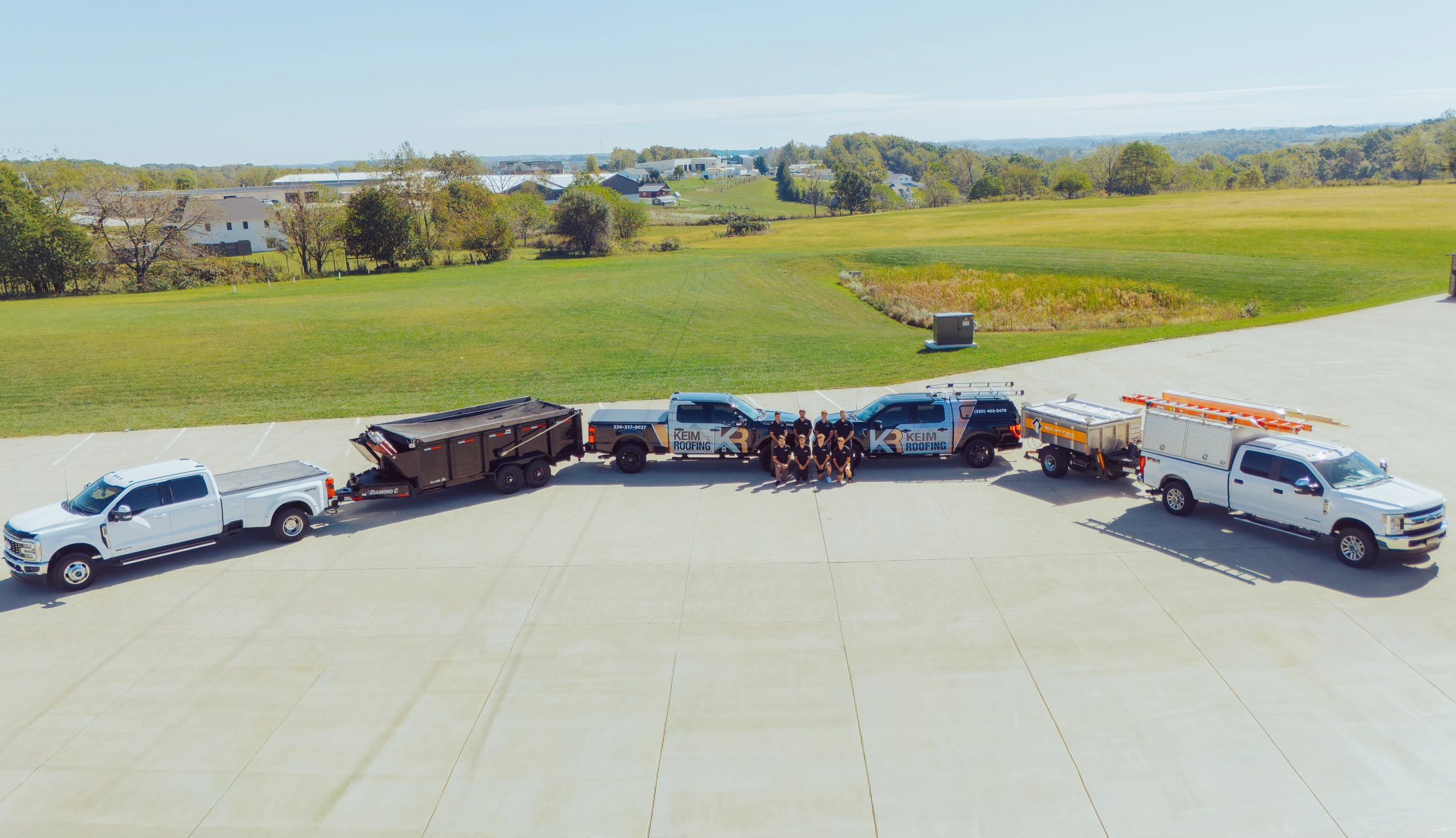 aerial view keim quality team posing in parking lot