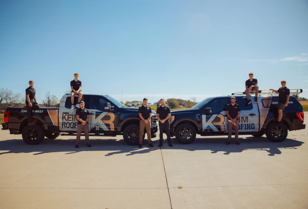 keim quality roofers team posing outdoor lot