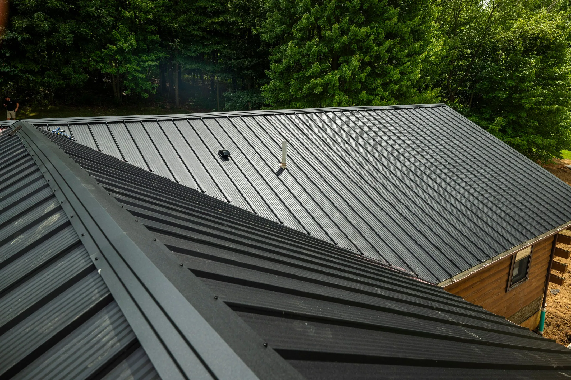 modern dark gray metal roofing under construction