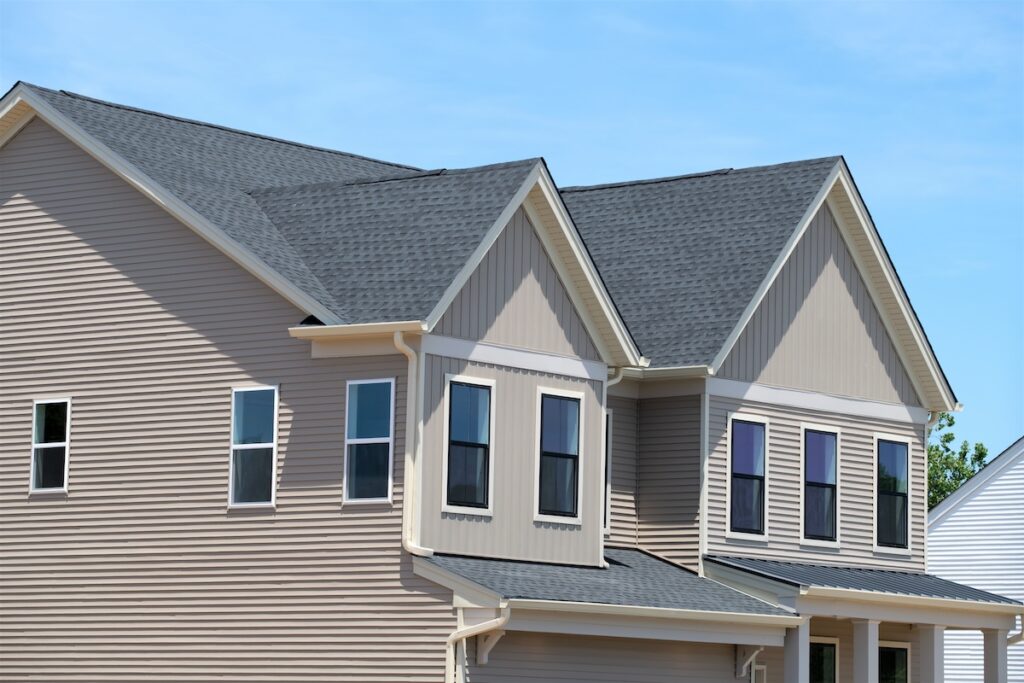 roofing new philadelphia oh Beautiful new home exterior with on sunny day roof window modern front