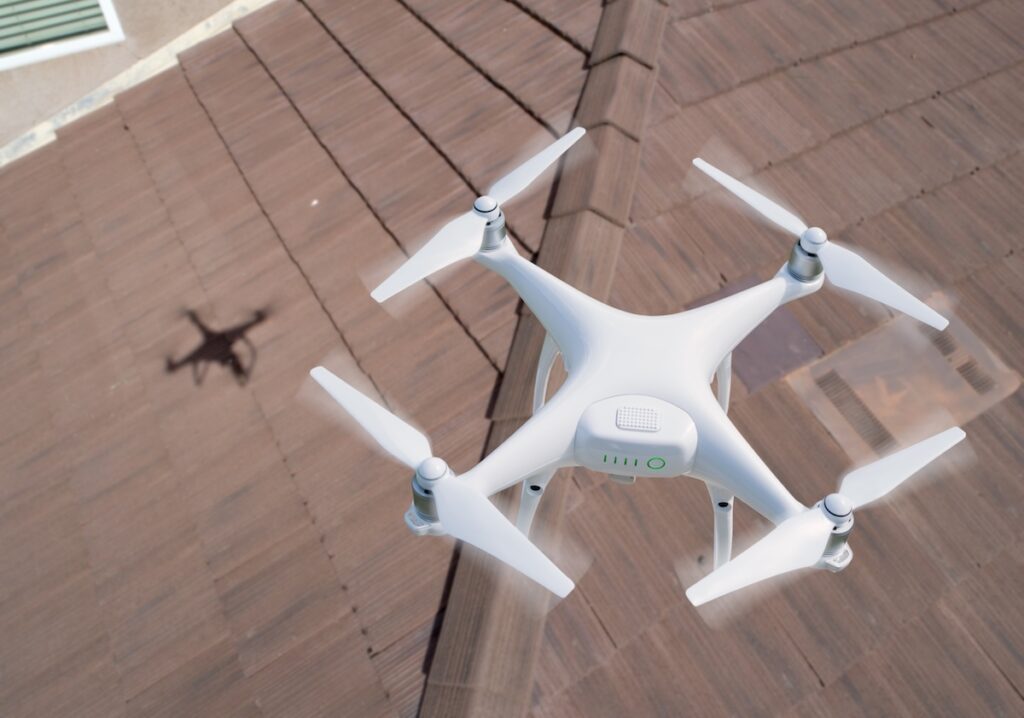 roof inspection cost Quadcopter UAV Drone Flying A Residential Roof Inspection.