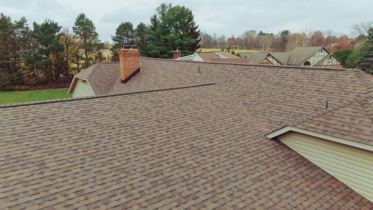 architectural shingles vs 3 tab brown roof light yellow sliding autumn season big family house