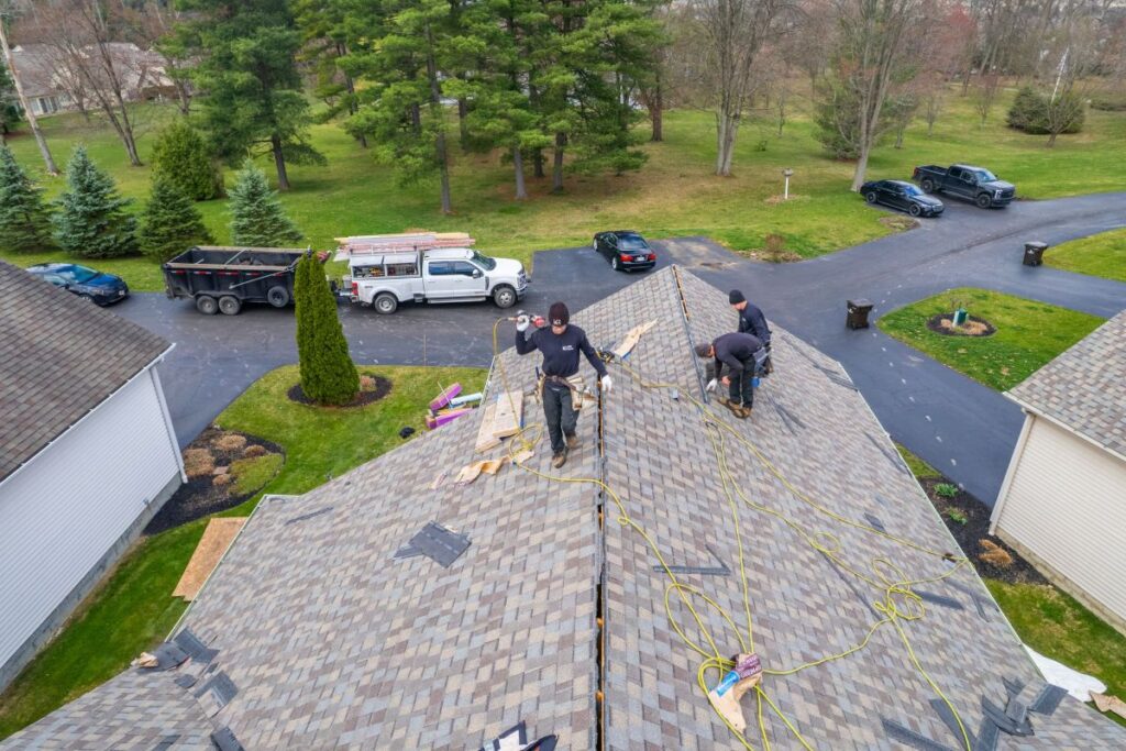 missing shingles Keim Quality Roofing workers replacing roof
