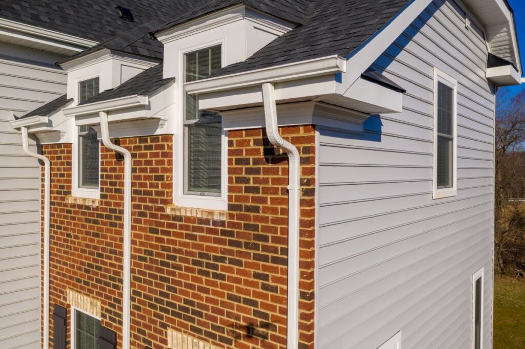 what is fascia on a house white fascia big house brick walls charcoal shingles roof