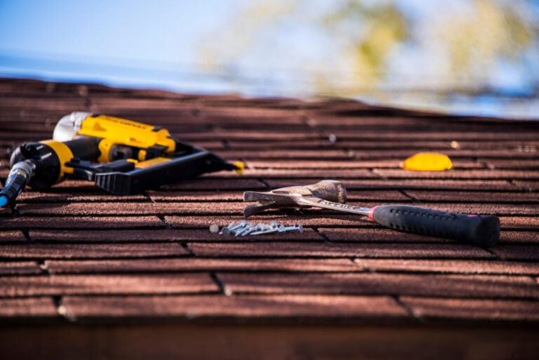 roofing tools on top of shingles roof