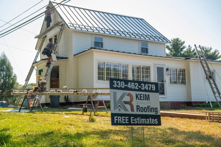 gaf timbersteel workers installing new metallic roof