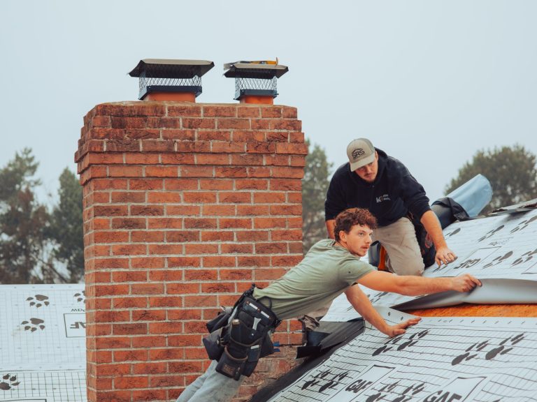 worker replacing metallic roof